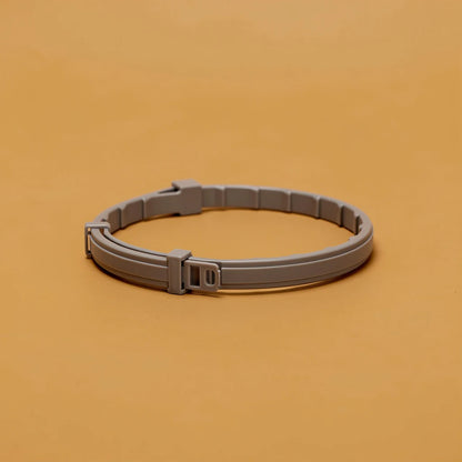 Grey anti-flea pet collar, studio photo