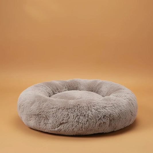 Taupe donut cuddler pet bed, studio photo