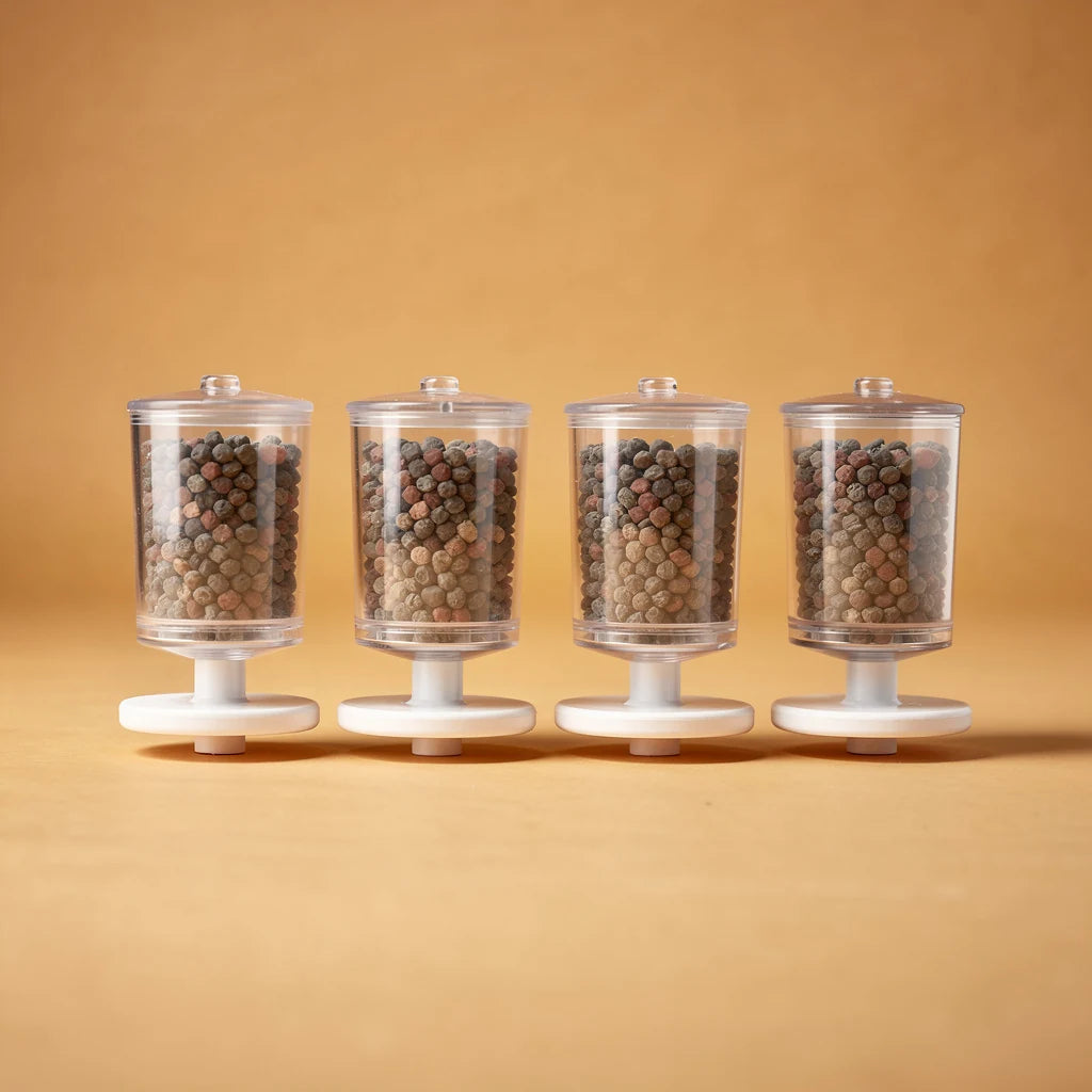 Four ceramic fountain replacement filters, studio photo