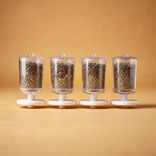 Four ceramic fountain replacement filters, studio photo
